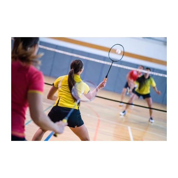 People playing badminton indoors showcasing sports toys to buy sports toys online Sam's World Ahmedabad Gujarat