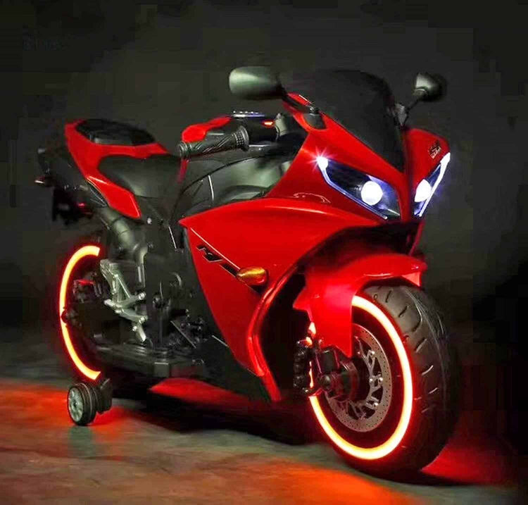 Red electric ride on bike for kids with glowing wheels available to buy ride on bike home delivery Ahmedabad Gujarat India