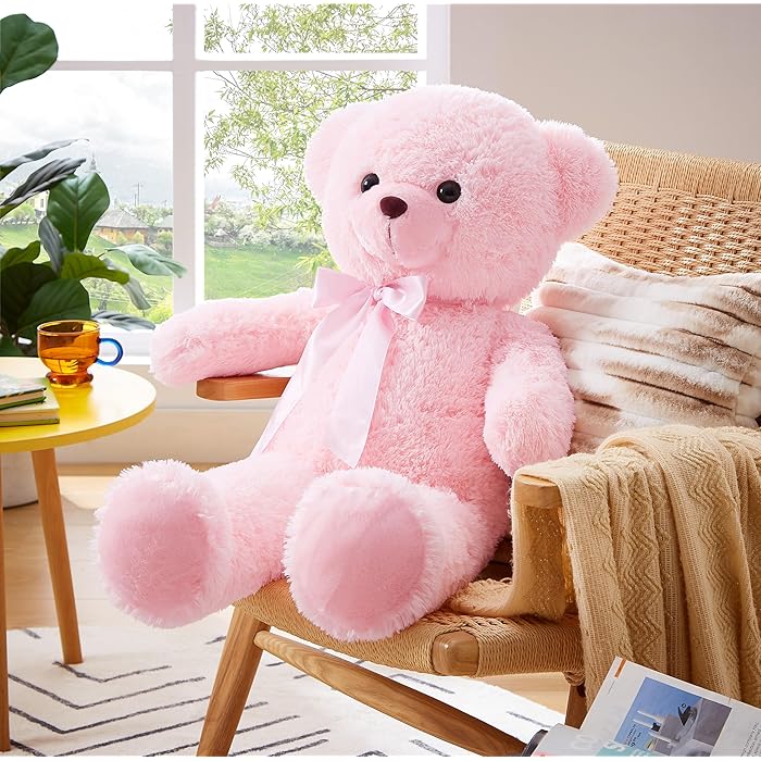 Pink plush large teddy bear with bow on chair large teddy bear for birthday for Girl in Ahmedabad Gujarat online India .