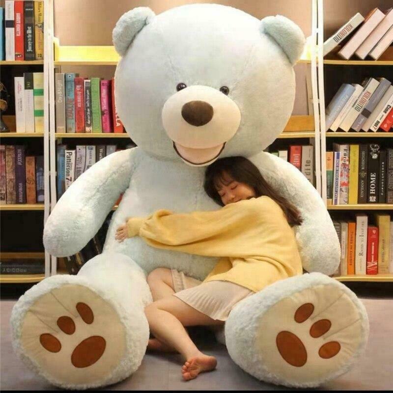 large plush teddy bear for gift for all age in Ahmedabad Gujarat . young woman hugging the extra large light blue teddy bear