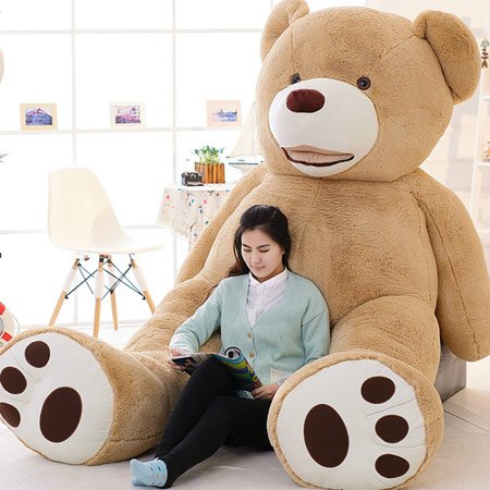 Woman reading beside giant beige plush bear large plush teddy bear for gift for all age in Ahmedabad Gujarat . samstoy.in