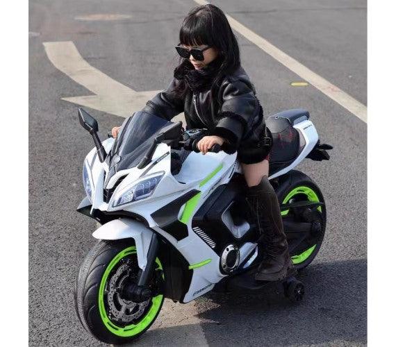 Kid riding FUN N FUNKY white toy motorcycle with green details Buy battery operated bike for kids in Ahmedabad Gujarat India