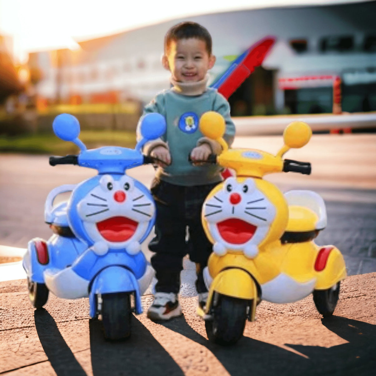 Child standing between blue and yellow Electric Kids Bike Make In Ahmedabad with cartoon designs