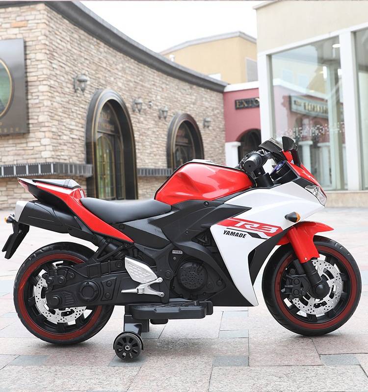 Red and black electric motor bike for children with realistic design and functional wheels