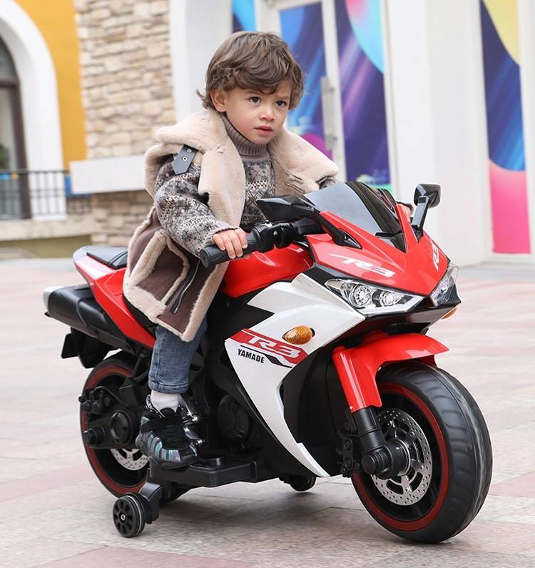 Red electric motor bike for children with sleek design and easy-to-use controls