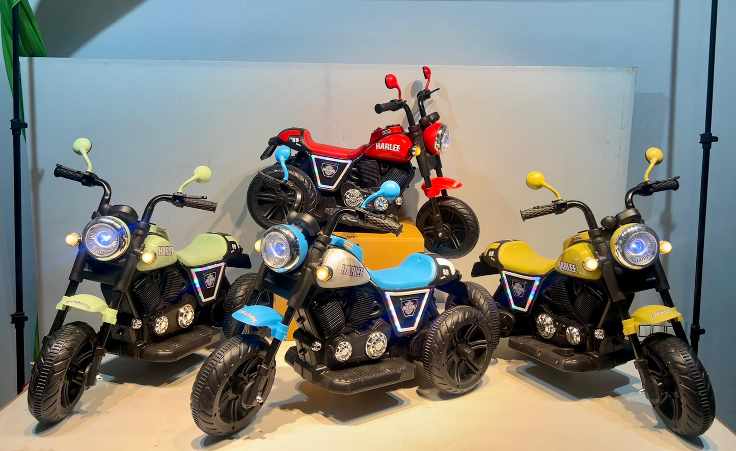 Colorful rechargeable kids bike Ahmedabad Gujarat in red blue yellow and green for children riding fun
