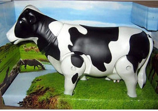 Black and white plastic cow toy with movable joints, side view, ideal for playtime and farm-themed activities