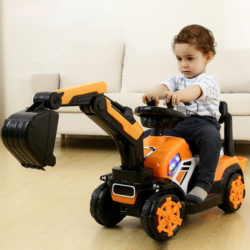 Toddler riding an orange JCB toy car for kids 2-8 years excavator battery operated indoors