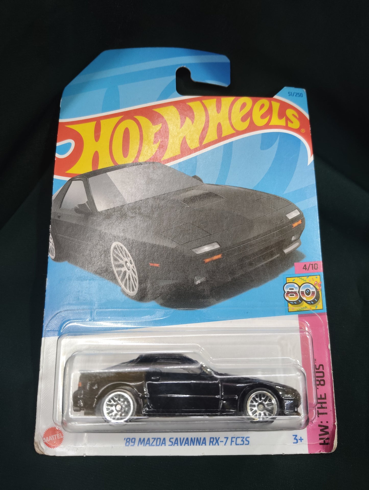 Hot Wheels '89 Mazda Savanna RX-7 Ahmedabad Gujarat online India . Black diecast car in sealed blue carded packaging showing art