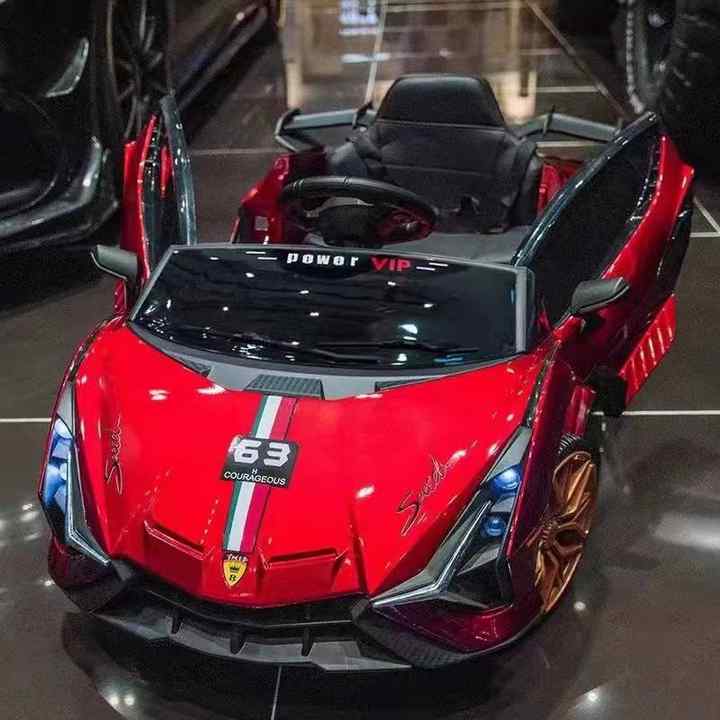 Red kids sports electric car with scissor doors and gold wheels children's electric toy car best price Gujarat