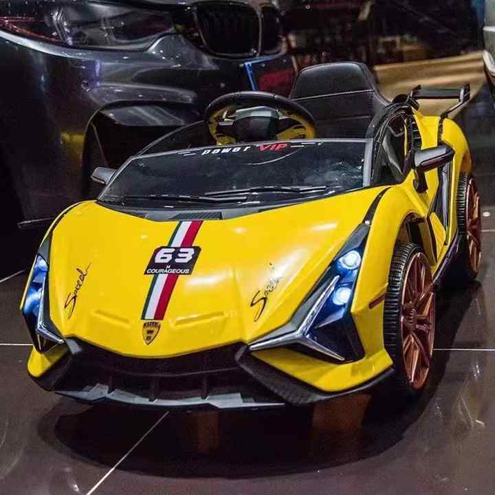 Yellow luxury kids ride on sports car with racing stripe and LED headlights children's electric toy car best price Gujarat