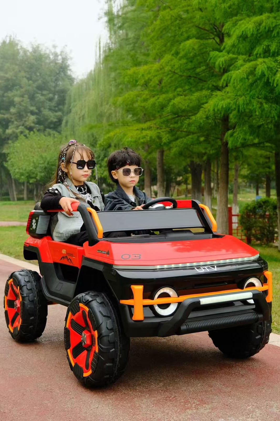 Rechargeable Kids Ride On Jeep Tesla Model Make In India with two children driving outdoors