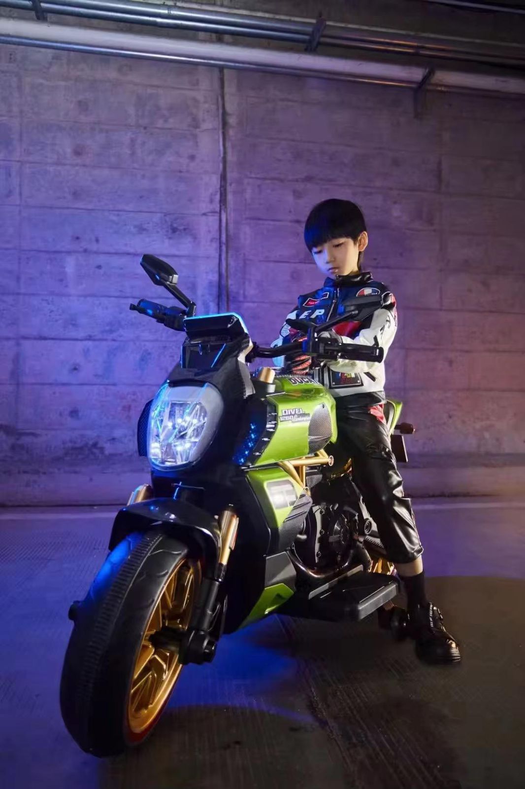 Child riding a FUN N FUNKY rechargeable ride on motorcycle for children Gujarat in a dark garage