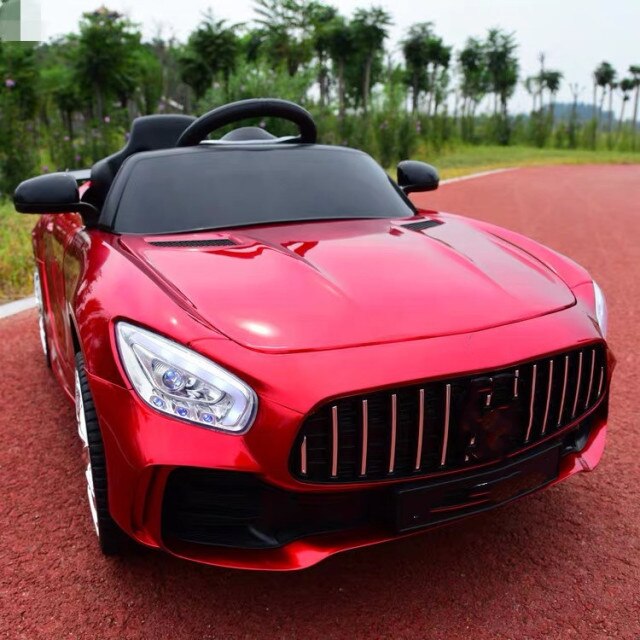 Red remote control kids car 1-8 years modeled like a luxury sports car on outdoor track