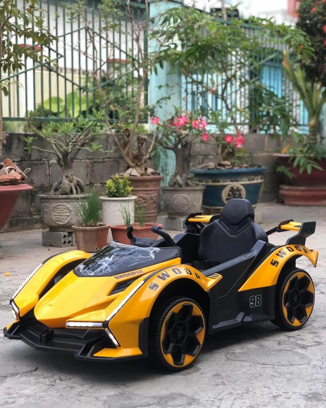 Yellow remote control sports car toy for children in Ahmedabad Gujarat India with sleek design and comfortable seat