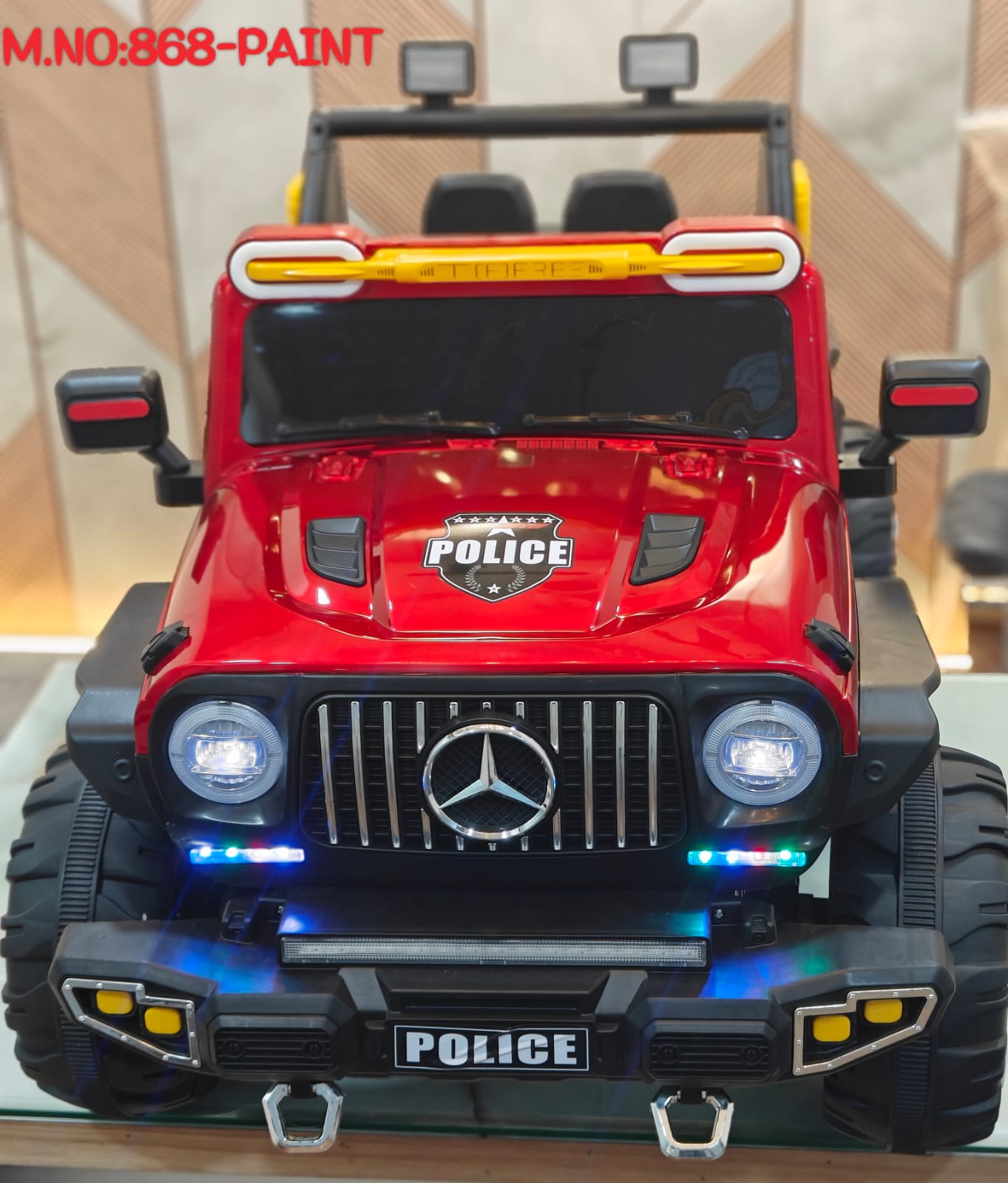 Red police-themed ride-on car for boys and girls Ahmedabad Gujarat with realistic lights and large tires