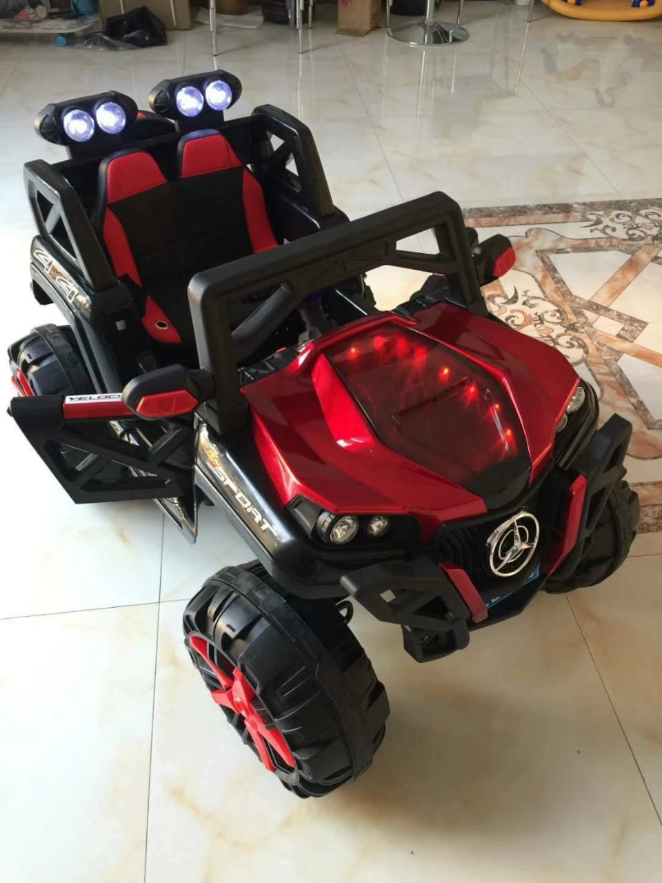 Red Ride on Toy Off-road Vehicle Ahmedabad Gujarat with LED lights and spacious seating for kids