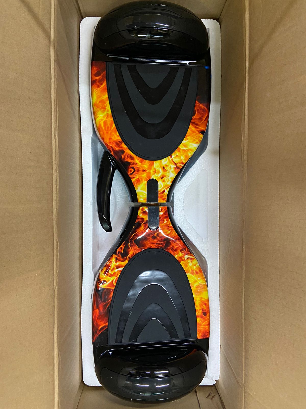 Black hoverboard with fiery flame design, top view, for kids outdoor fun in Ahmedabad Gujarat by Sam's Toy