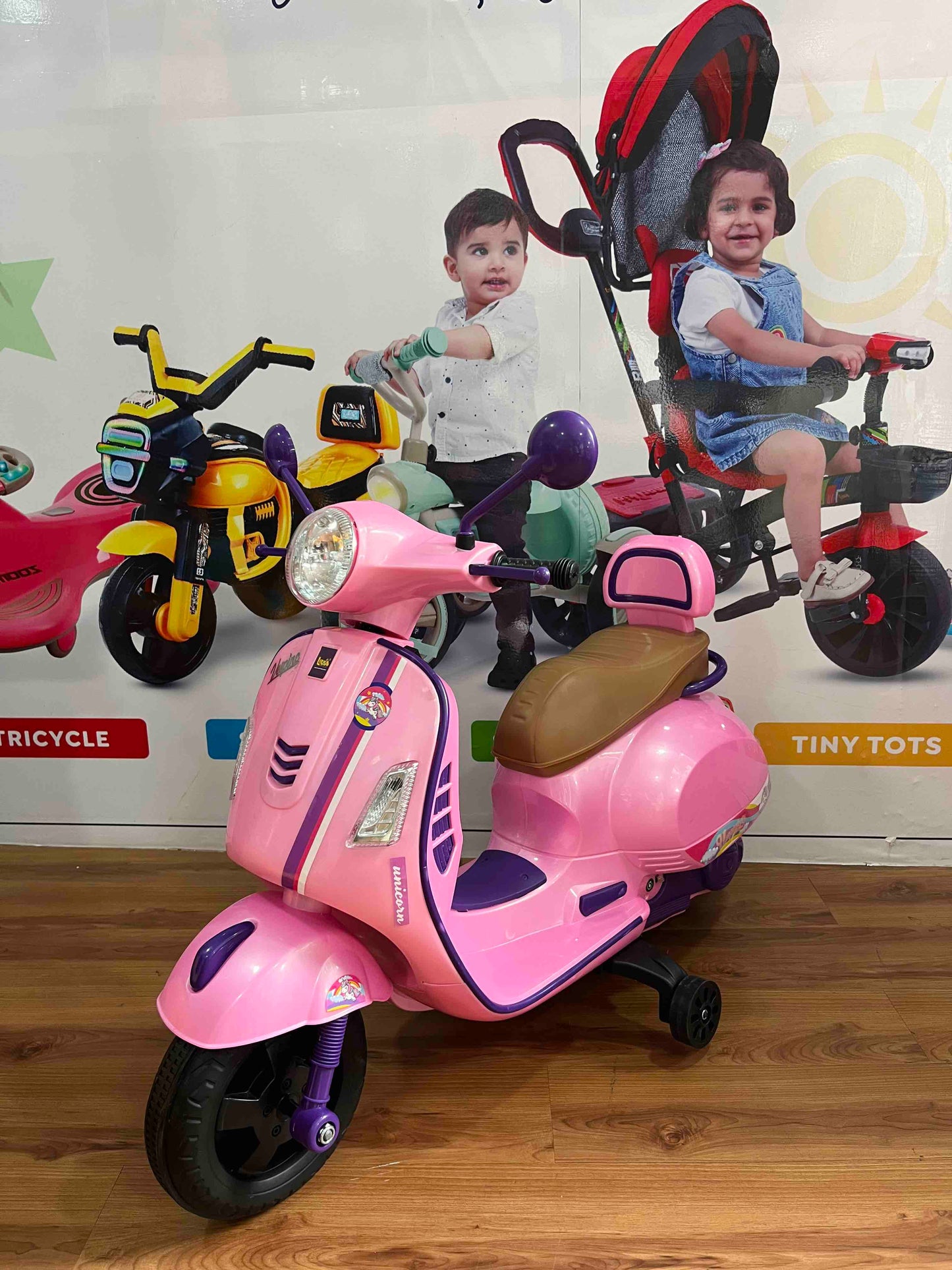 Pink electric scooter toy with training wheels Luusa Vespa Scooter for Kids from Sams Toy World, made in India