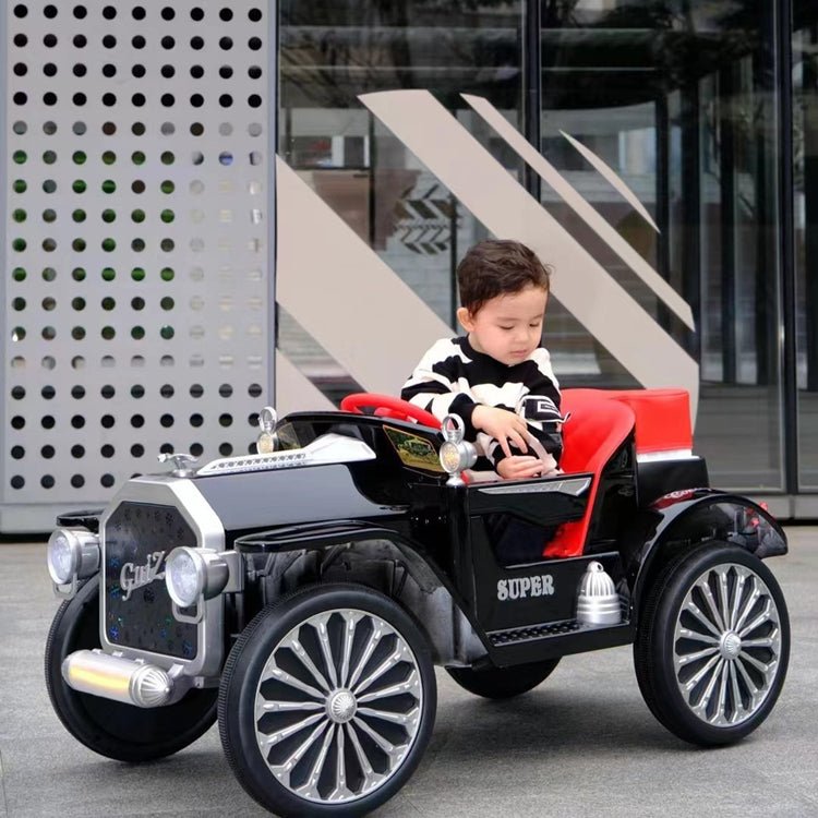 vintage Mercedes ride on car for kids battery operated in Gujarat child in black car with red seat and chrome wheels