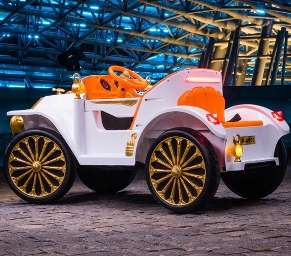 vintage Mercedes ride on car for kids battery operated in Gujarat . White and gold electric toy with orange seat and gold wheels