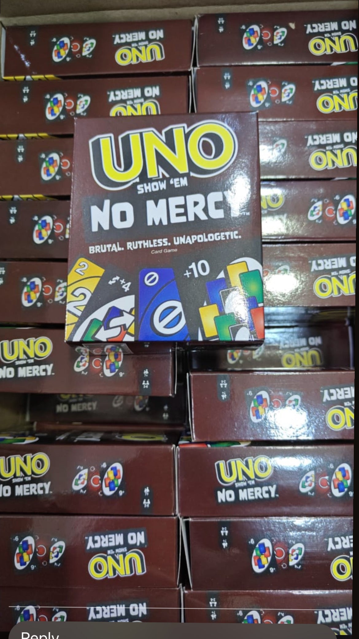 UNO Show 'EM No Mercy card game offer price in Ahmedabad stacked boxes with colorful cards