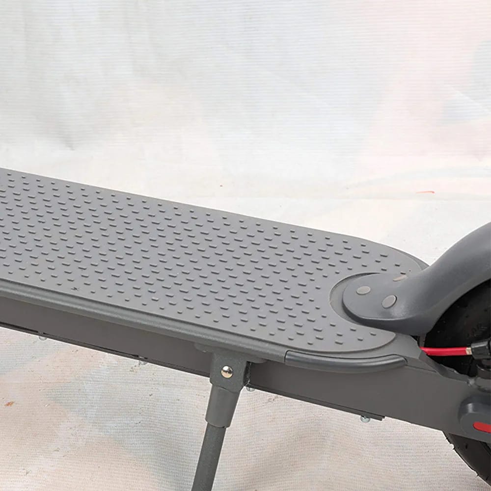 Close-up of foldable electric scooter for kids and all ages Ahmedabad Gujarat with textured deck and kickstand