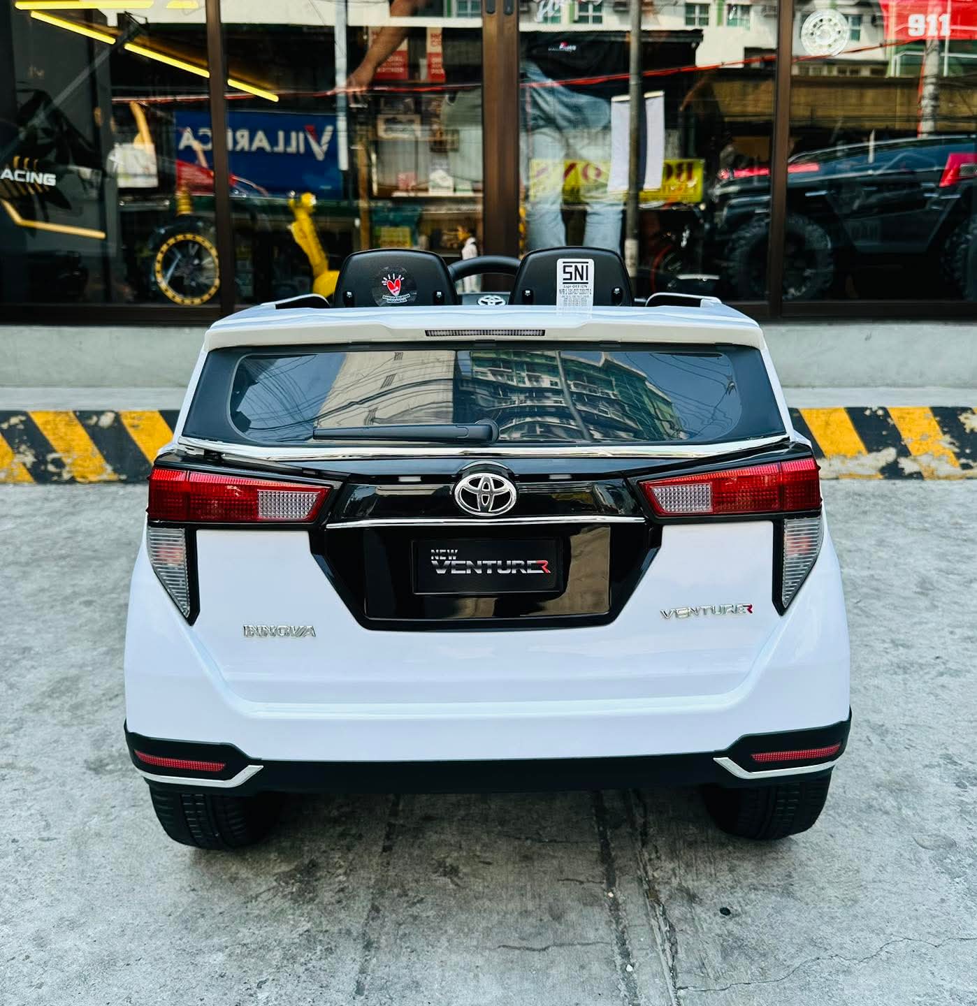 2026 Toyota Innova battery operated ride-on car featuring a sleek white design and stylish rear view