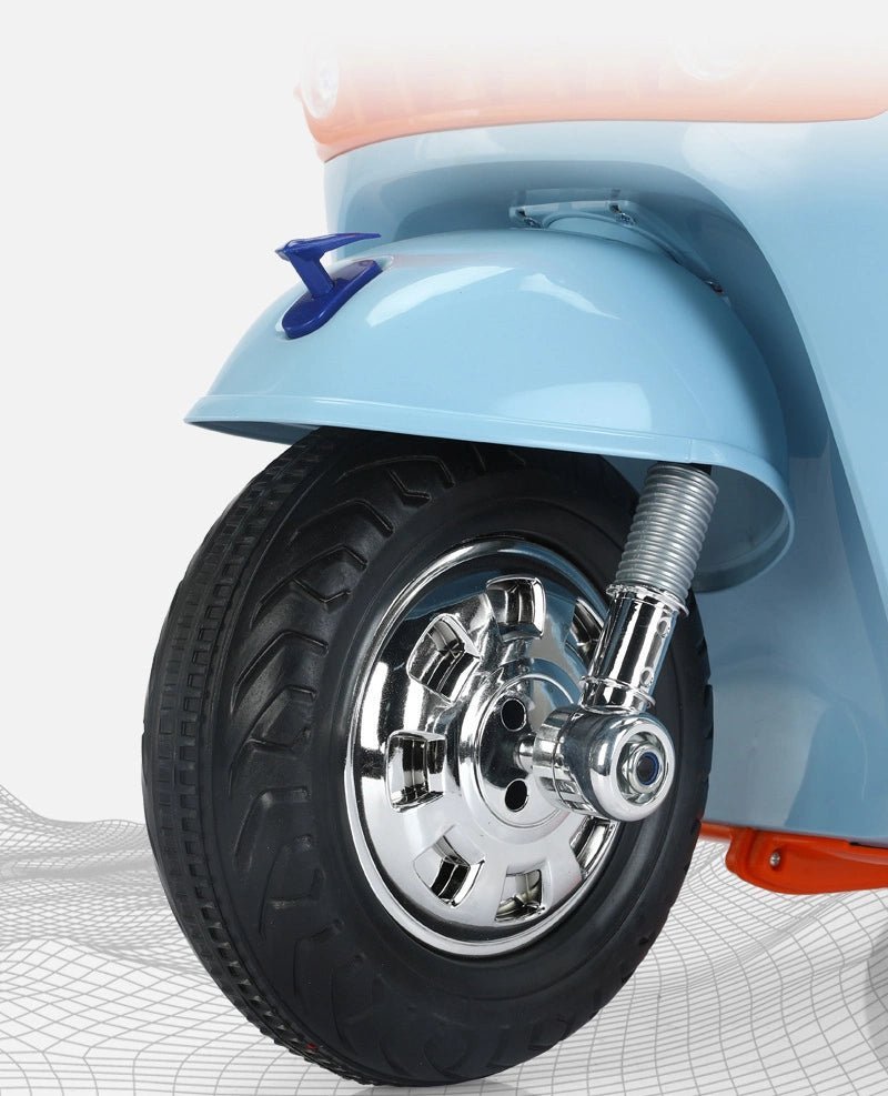 Close-up of Battery Gulf scooter for kids Ahmedabad Gujarat showing the front wheel and chrome details