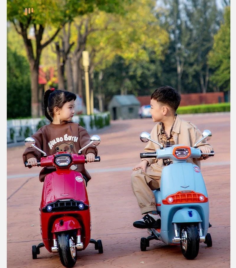 Two children riding Battery Gulf scooter for kids Ahmedabad Gujarat in a park setting