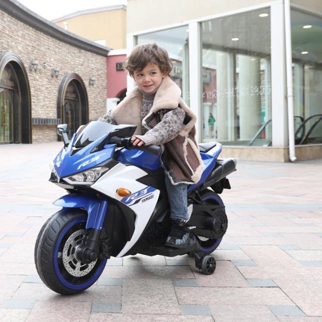 FUN N FUNKY battery operated kids motorcycle in blue with a child rider enjoying outdoor play