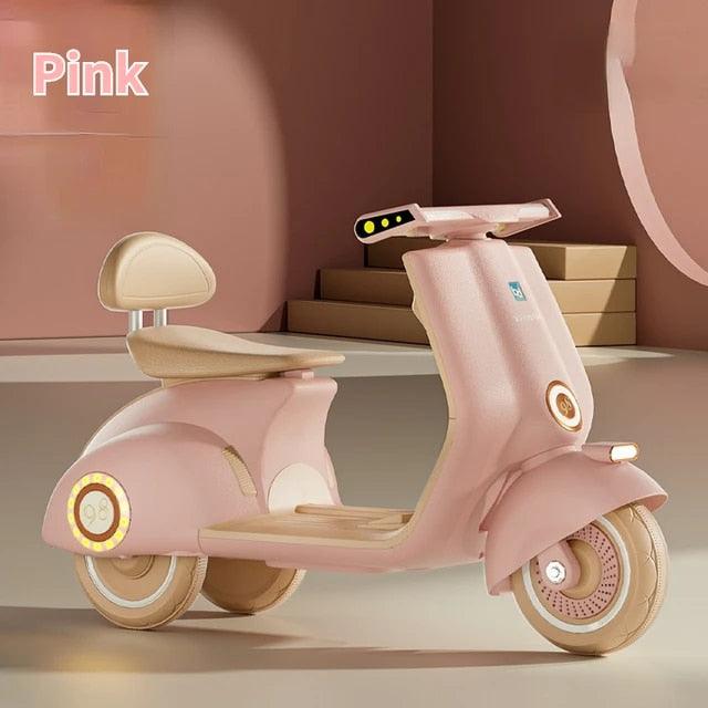 Pink battery operated kids scooter Ahmedabad Gujarat India with comfortable seat and modern design