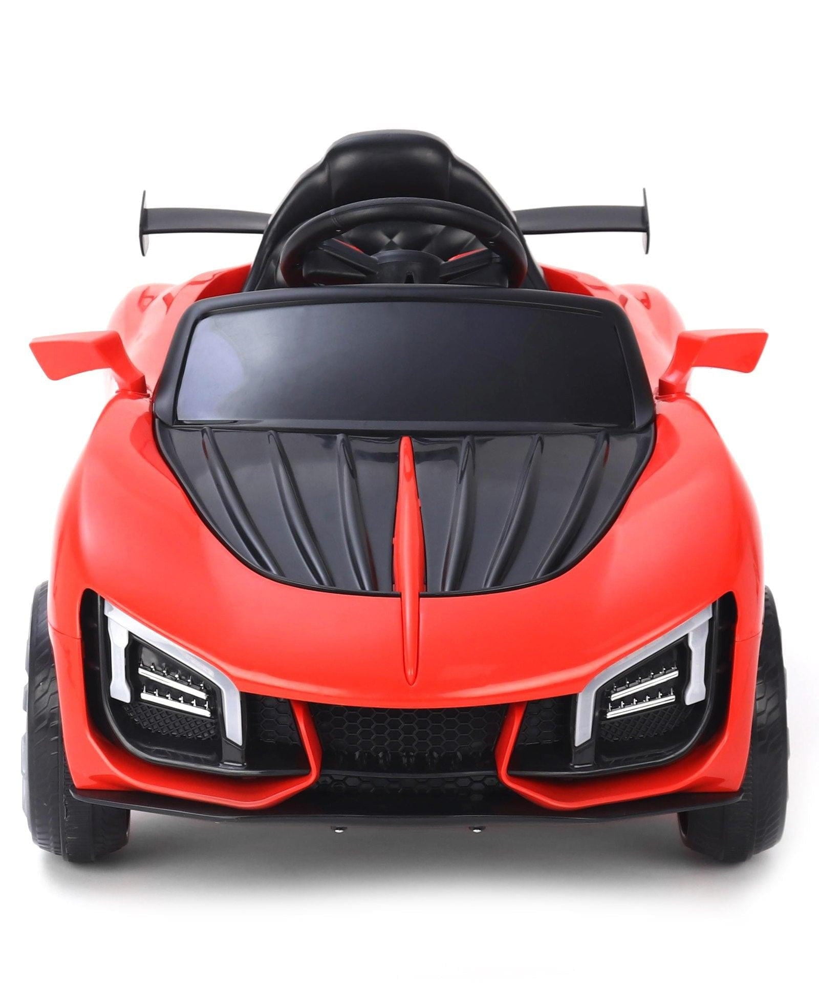 Red battery operated ride on car for kids near me Gujarat with black steering wheel and sporty design