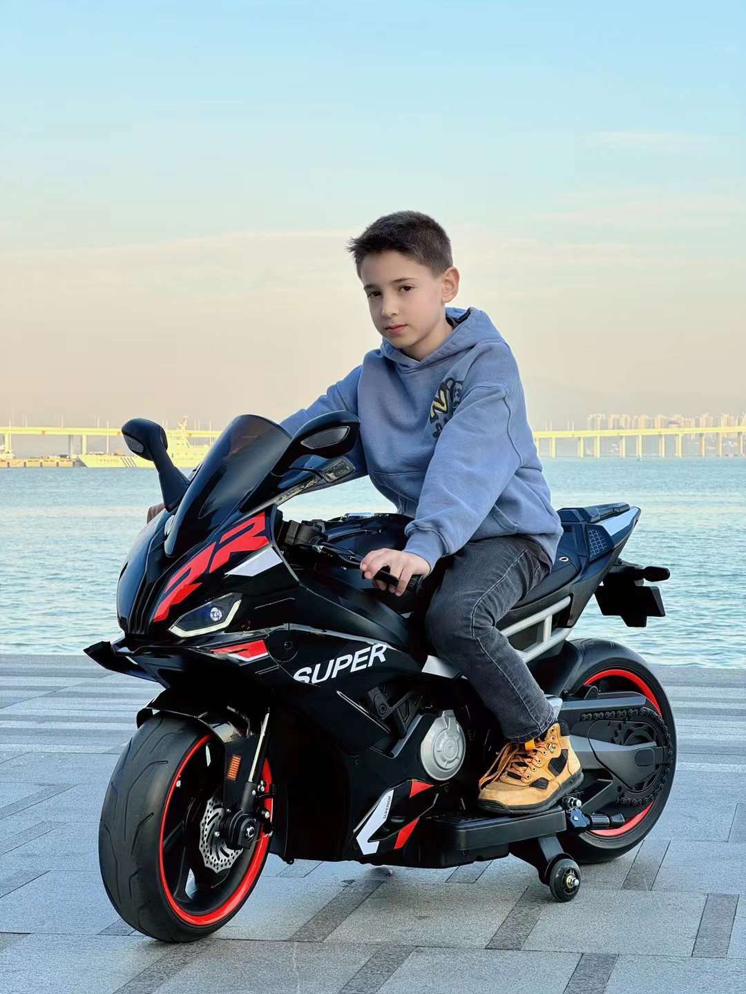 Child riding FUN N FUNKY black toy motorcycle best electric motorcycle ride on bike toy for children Ahmedabad