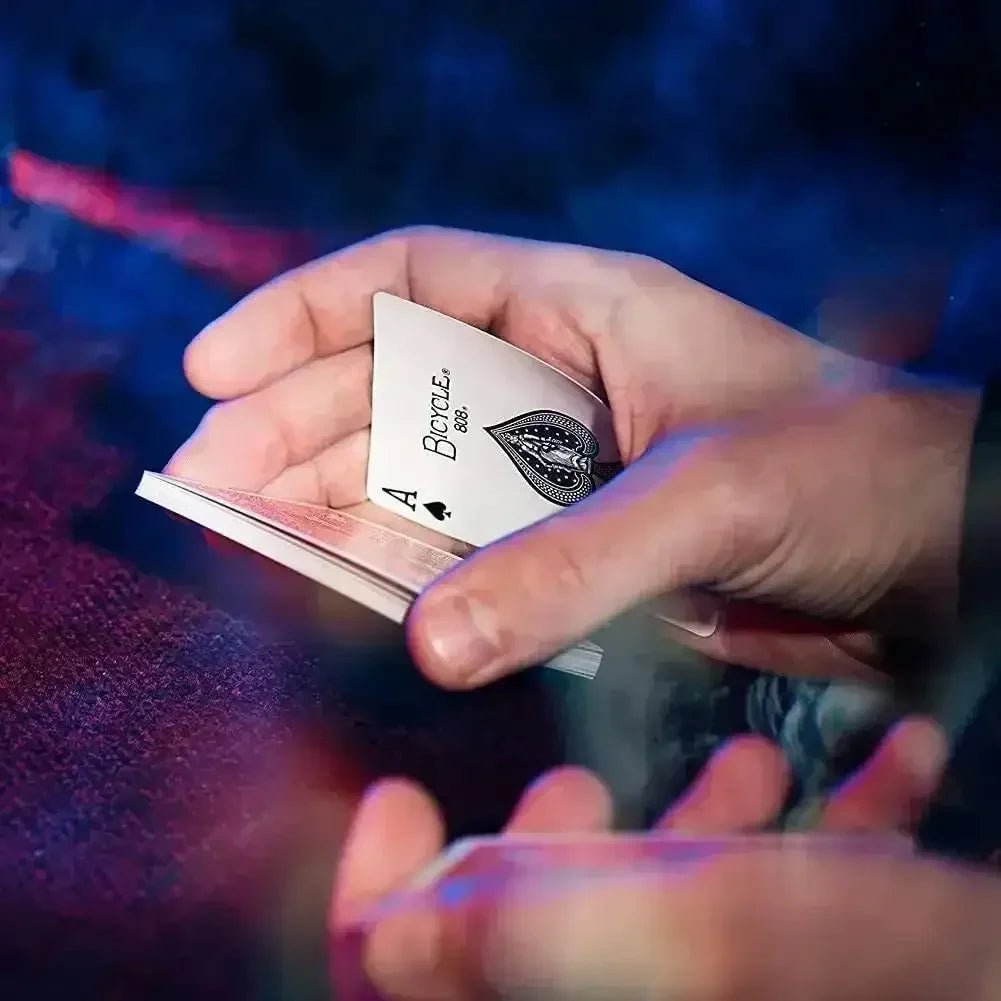 Close-up of a hand holding an Ace of Spades playing card, ideal for games of playing cards