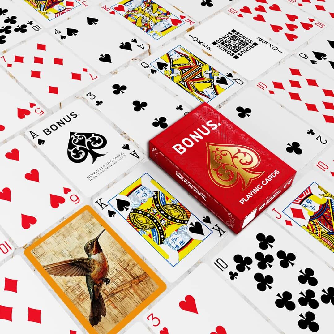 Parksons gaming playing cards in a red box, laid out with decorative illustrations for classic card games