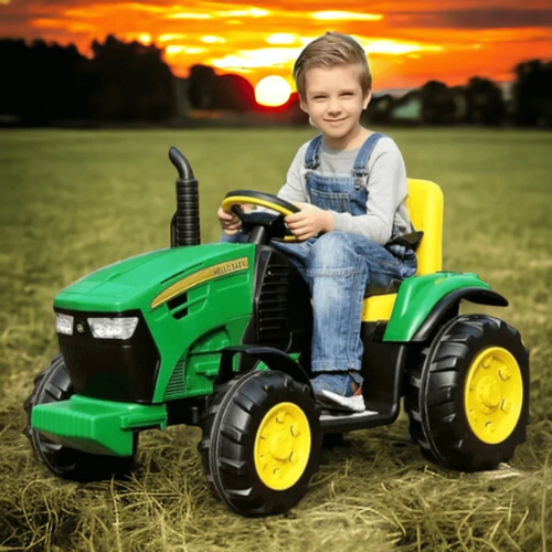 Child riding a green and yellow toy tractor outdoors at sunset Buy John Deere kids tractor Ahmedabad Gujarat