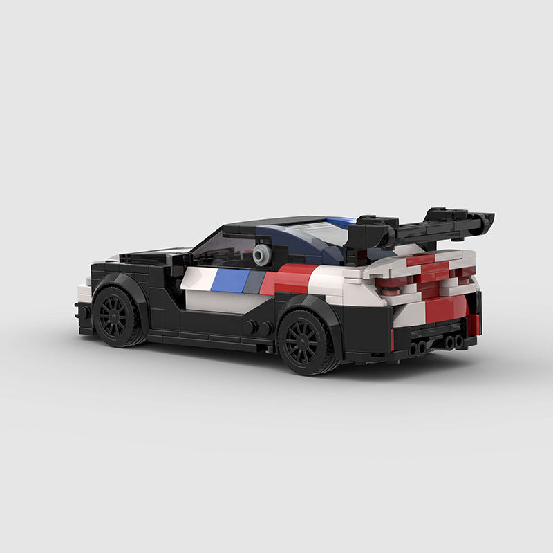 Black and white car toy BMW M4 at Sam's Toy World Ahmedabad, rear view, perfect for creative play