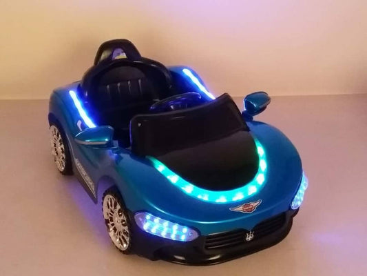 Bright blue children battery operated car with stroller at Sam's Toy World Ahmedabad featuring LED lights and a sleek design