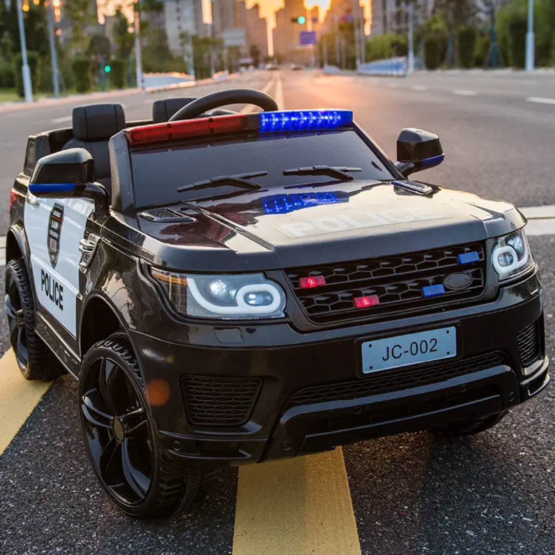Black childs electric ride on car with police decals, front view, perfect for imaginative outdoor play