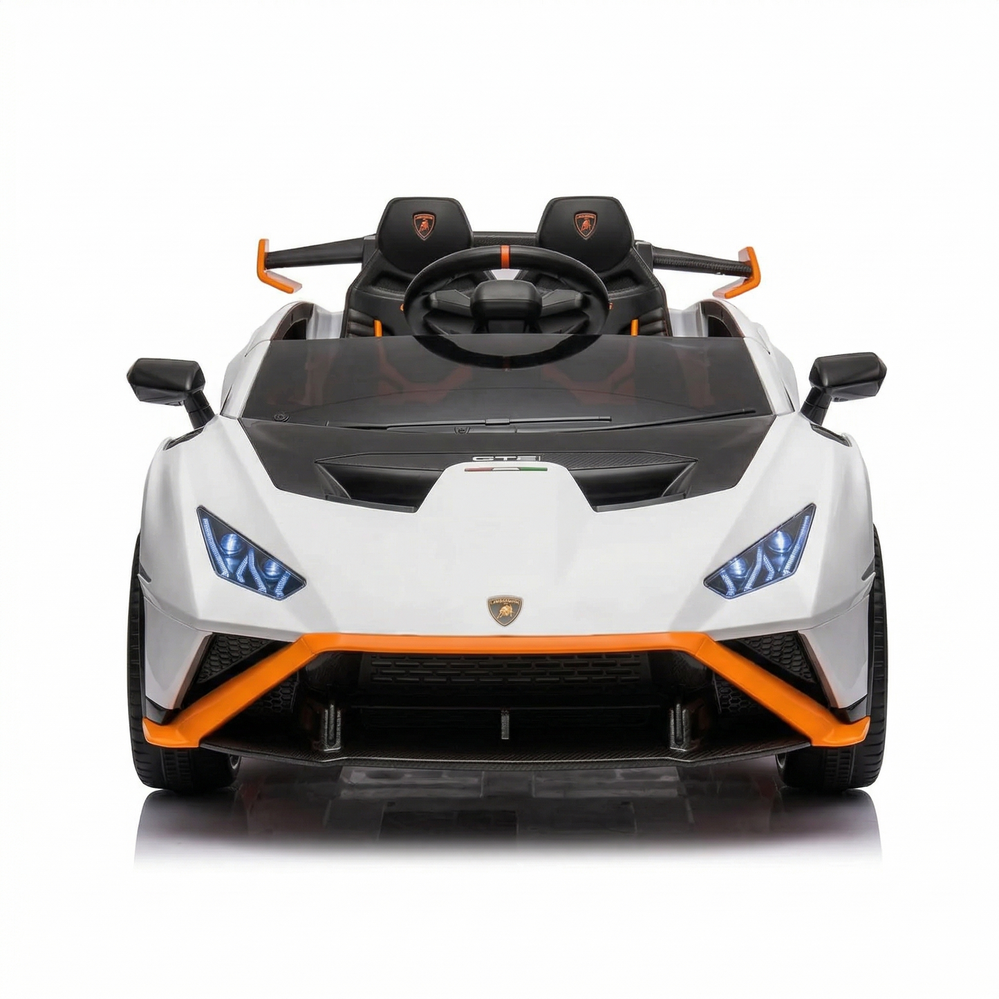 White childs electric ride on car with black and orange accents, front view, perfect for outdoor fun