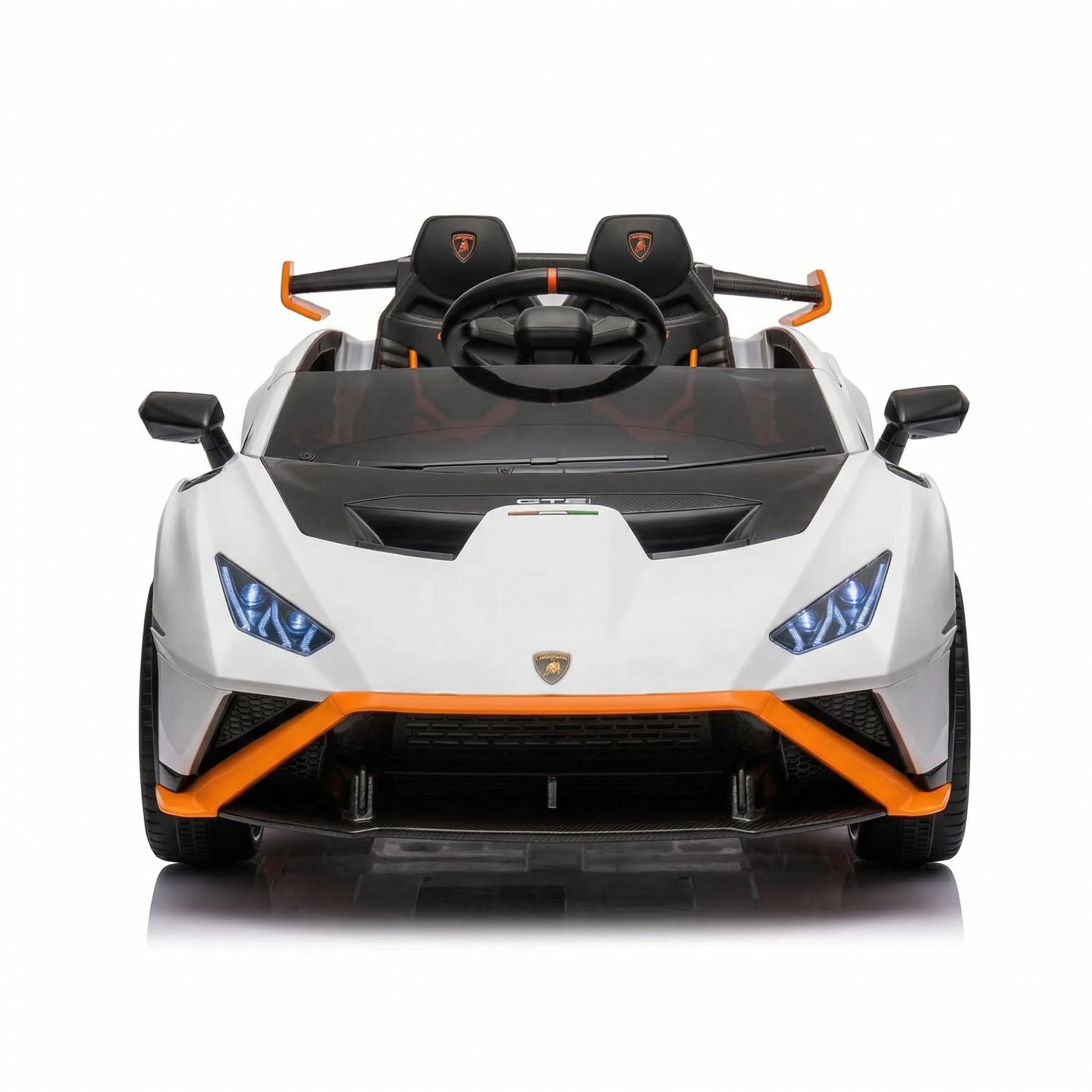 White childs electric ride on car with black and orange accents, front view, perfect for outdoor fun