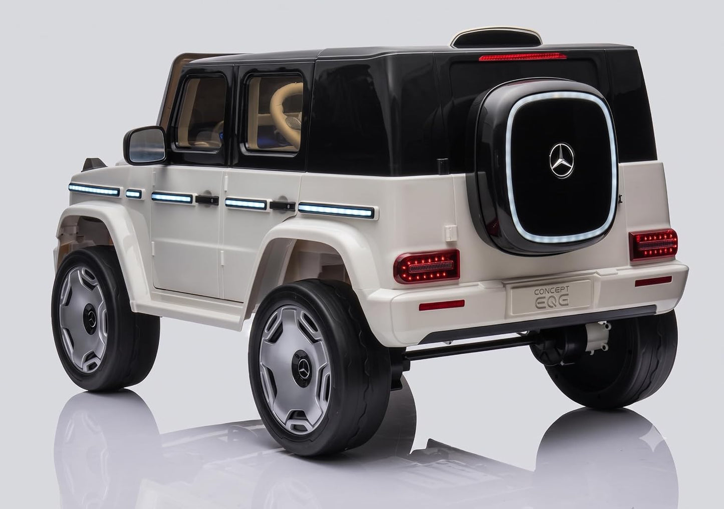 White and black child's ride on electric car, rear view, designed for outdoor fun and play