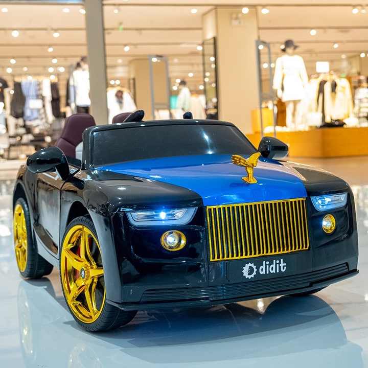 Rolls Royce ride on car for kids Ahmedabad online India black and blue electric kids car with gold grille wheels in showroom