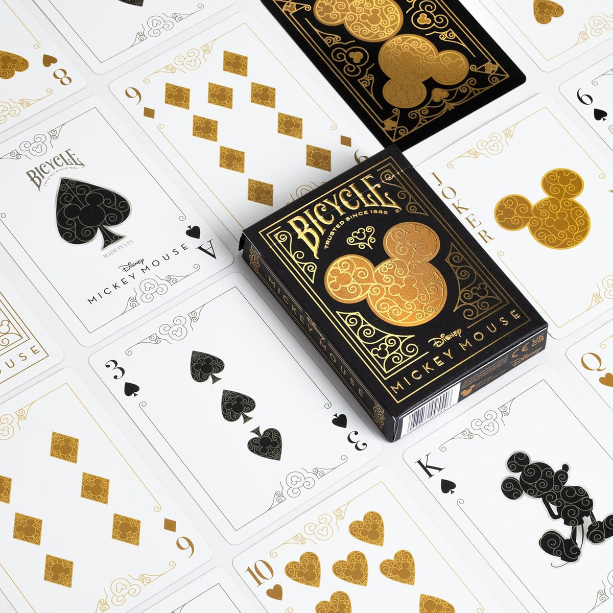 Mickey Mouse and Mickey Mouse Playing Cards in black and gold, top view, ideal for family game nights