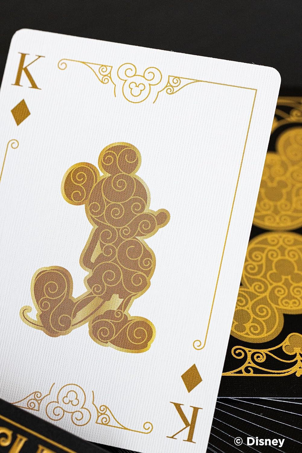 Mickey Mouse and Mickey Mouse Playing Cards featuring a gold silhouette King card design, perfect for family game nights