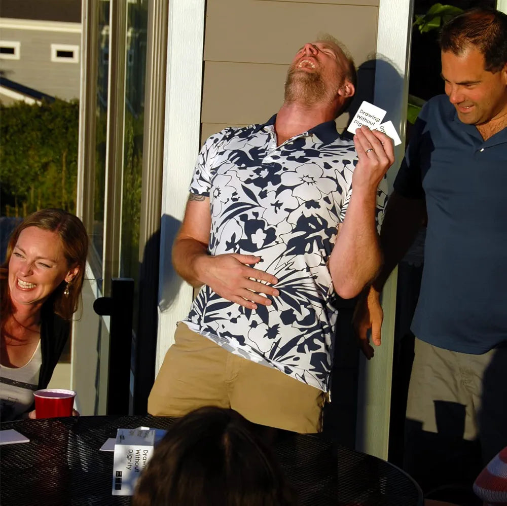 Group enjoying Drawing Without Dignity with expansion packs during a fun outdoor game night