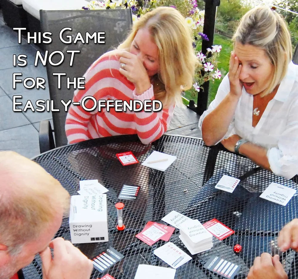 Group of friends laughing while playing Drawing Without Dignity with expansion packs, outdoor setting