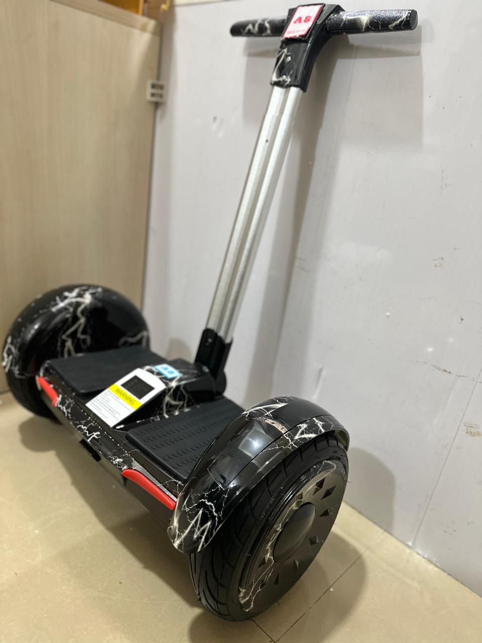 Handle hoverboard for kids and adults Ahmedabad Gujarat India black with marble design and silver handlebar