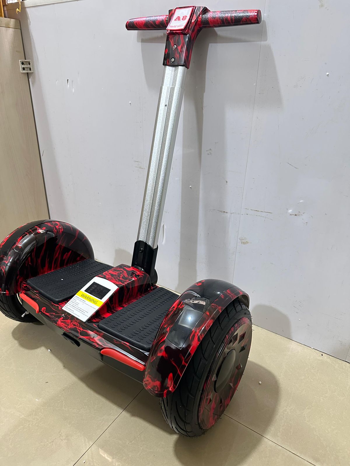 Red and black handle hoverboard for kids and adults Ahmedabad Gujarat India with sturdy wheels and adjustable handle